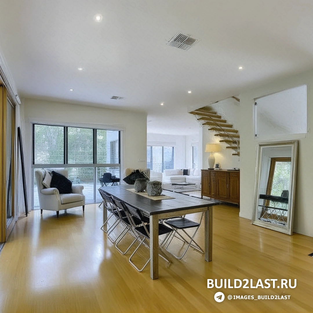 Интерьер дома с открытой планировкой, светлыми стенами и современным дизайном